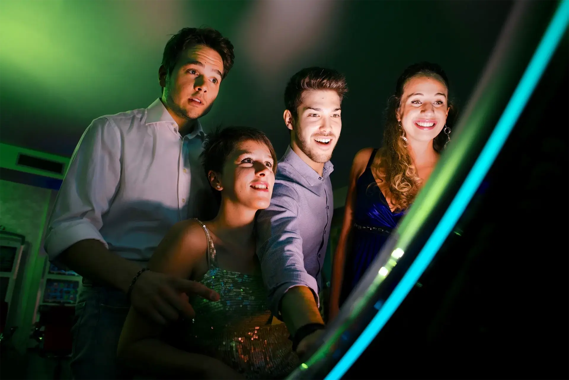 A group of people addicted to gambling staring at a slot machine in a casino.